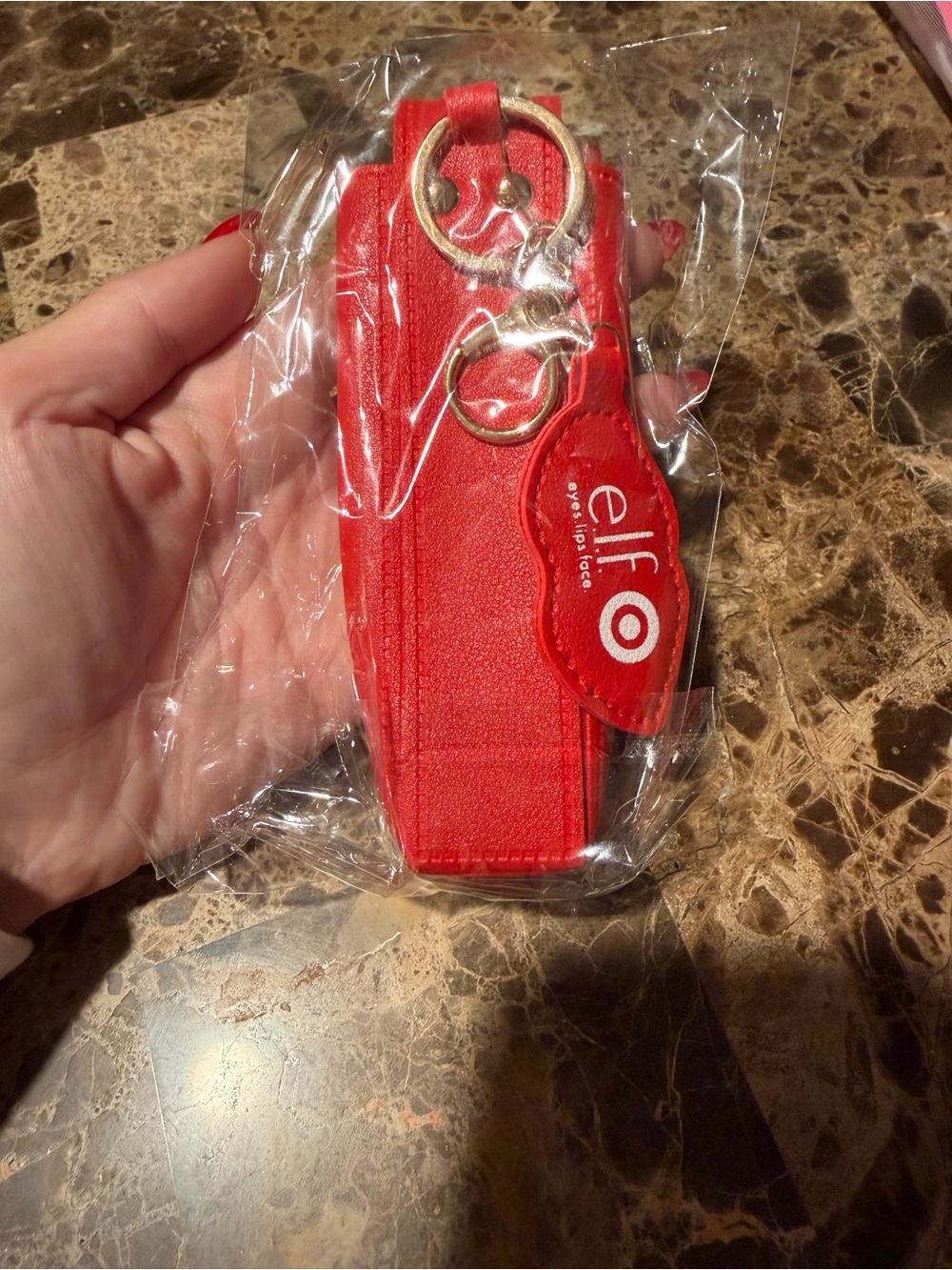Target elf red keyring phone holster with gold hardware